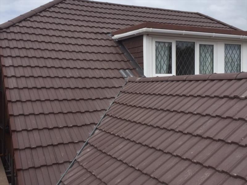 Tiled roof by Top Level Roofing & Building Solutions