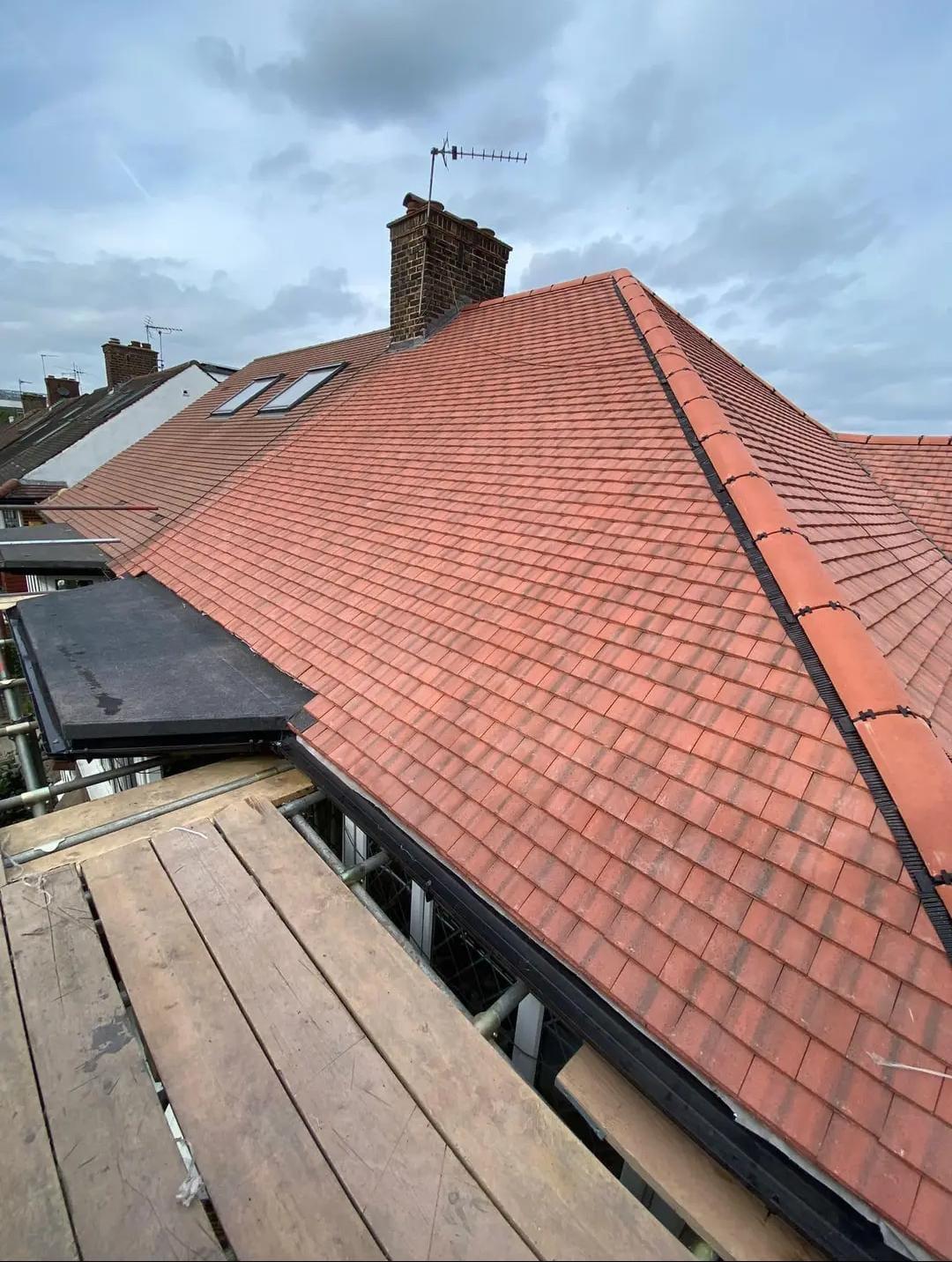 A finished red tiled pitched roof on a house in Hertfordshire