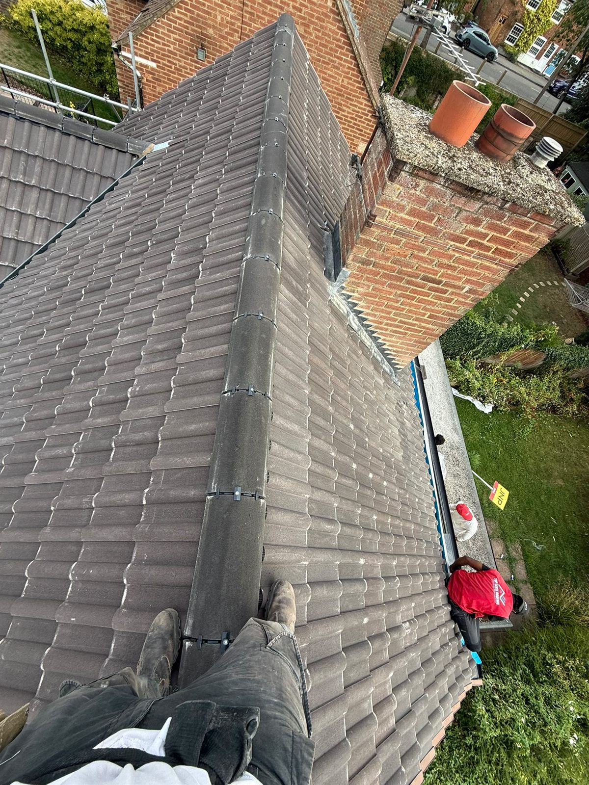 A completed tiled roof and ridge by Top Level Roofing & Building Solutions