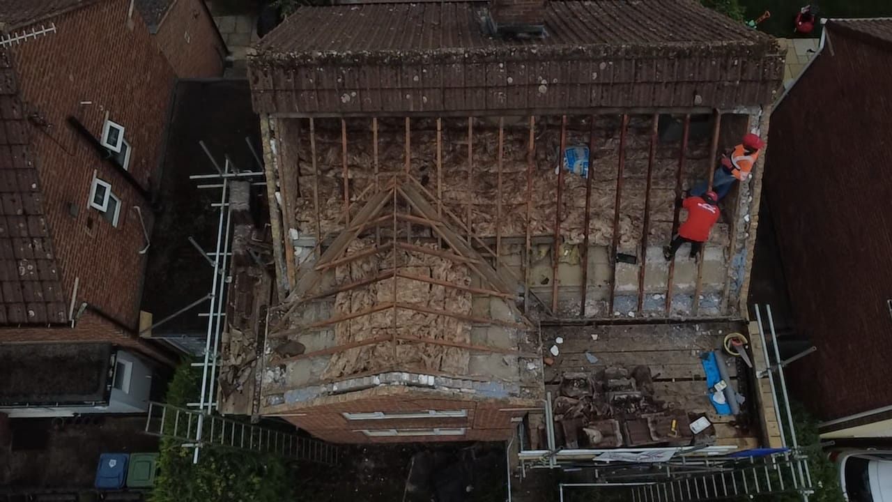 Aerial view of a roof replacement with bare rafters by Top Level Roofing & Building Solutions