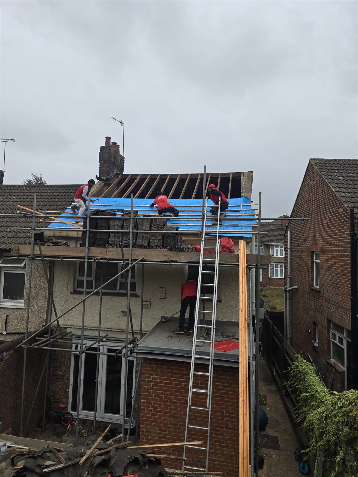The Top Level Roofing team re-felting a rear roof from scaffold