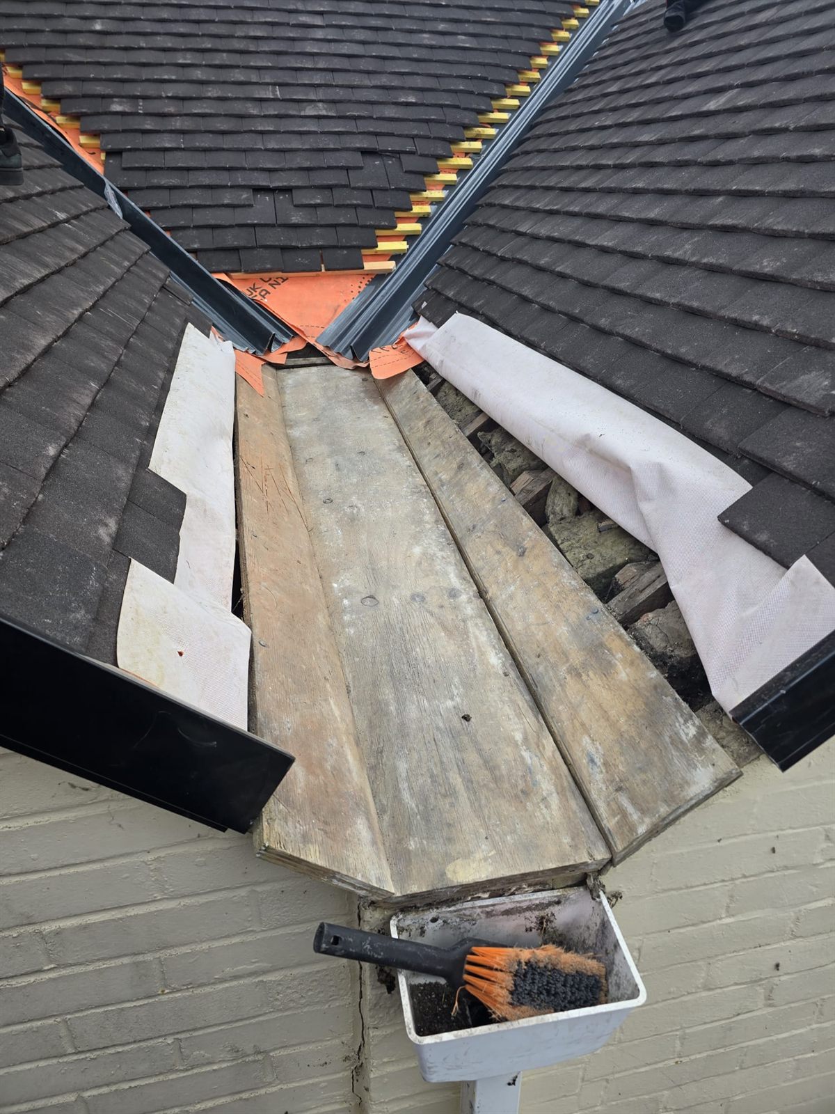 A new valley between two slate-effect roof slopes by Top Level Roofing & Building Solutions